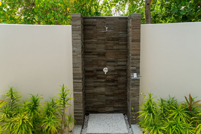 Elegant Shower with Natural Stone Walls